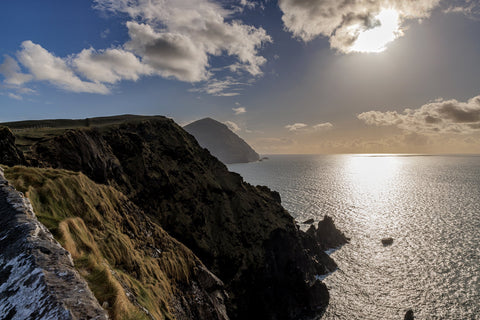 Clare Island looking towards the sun beaming down on the Atlantic Ocean.