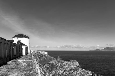 A black and white of Clare Island Lighthouse towards the Atlantic Ocean. 