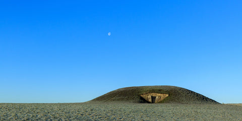 A cool winter morning with the moon still in the sky. The Mound of Hostages sits dominantly at the top of the Hill of Tara demanding the respect it deserves from the world around. The Mound of Hostages is a passage tomb that dates back to 3000BC – older than the pyramids of Egypt.