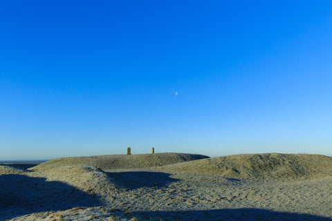 A quiet winter morning on the ancient stone age site. Oozing with history, Tara tells her story of a bygone age of pagan times and rituals. The Lia Fáil and the tombstone are symbols of those times. The moon in the morning sky keeping watch on this special place.  