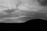  A black and white silhouette of the Mound of Hostages.